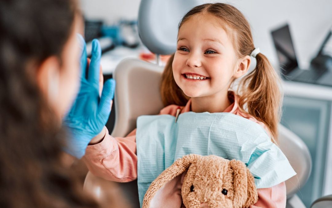 child holding toy in pediatric dentist office in Utah